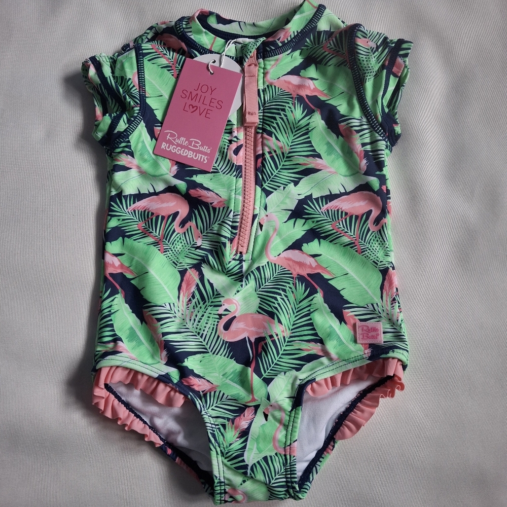 RuffleButts flamingo Frenzy One Piece Rash Guard Swimsuit Size 2T